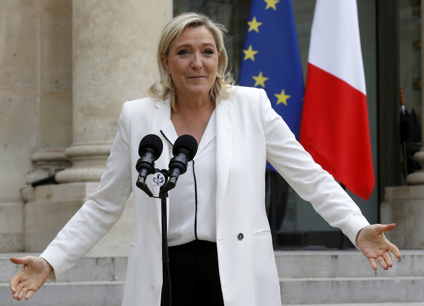 Marine Le Pen, France's far-right National Front political party leader, talks to journalists following a meeting with French President Francois Hollande (not pictured) after Britain's vote ...