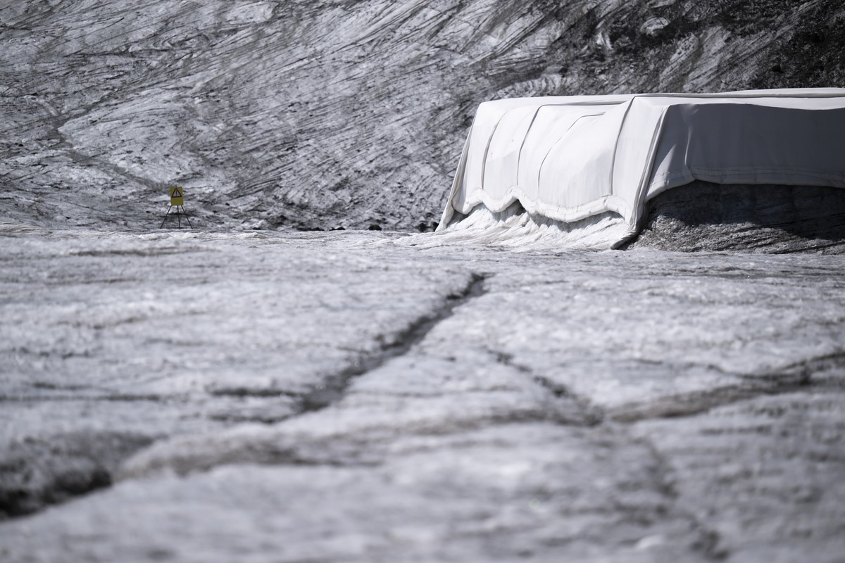 A blanket covering snow from the last winter season to prevent it from melting pictured between the Sex Rouge Glacier and the Tsanfleuron Glacier, at the "Glacier 3000" alpine resort, above  ...