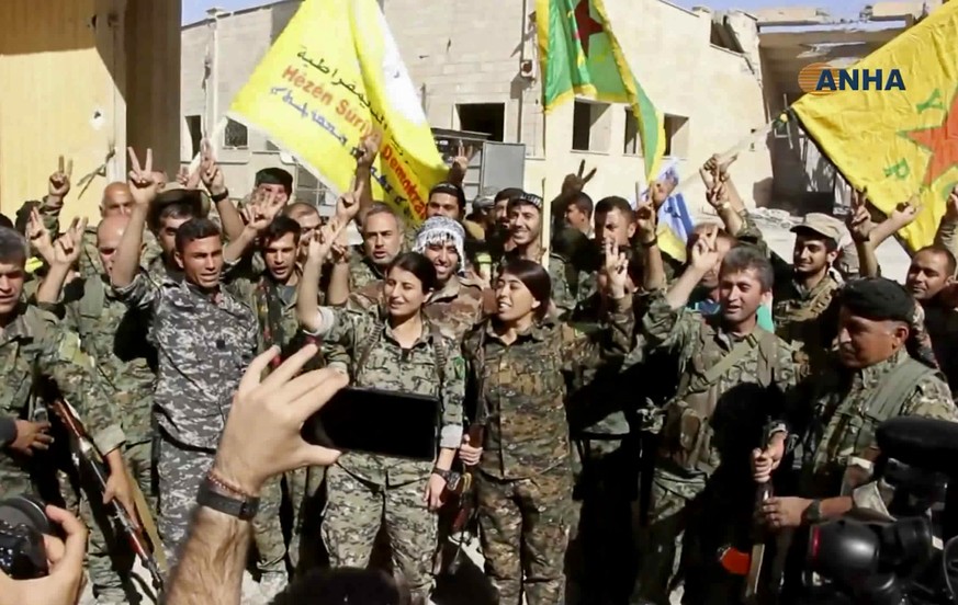 This frame grab from video released Tuesday, Oct. 17, 2017 and provided by Hawar News Agency, a Syrian Kurdish activist-run media group, shows fighters from the U.S.-backed Syrian Democratic Forces (S ...