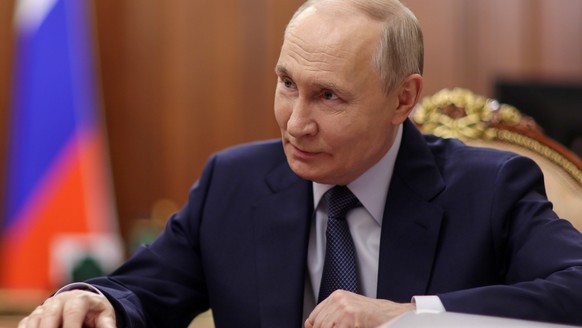 Russian President Vladimir Putin listens to Rashid Temrezov, the head of the Karachay-Cherkess Republic, during their meeting at the Kremlin in Moscow, Thursday, April 16, 2026. (Alexander Kazakov/Spu ...