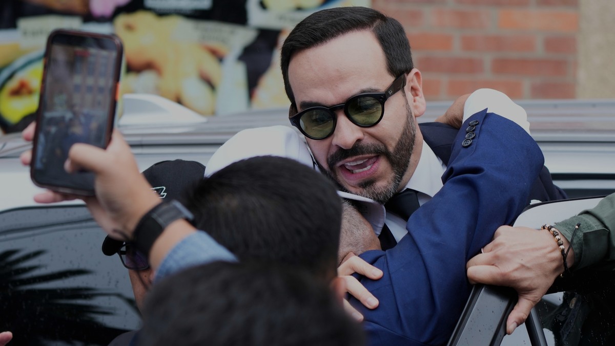 Colombian President-elect Abelardo de la Espriella is hugged by a supporter after a religious Mass in honor of Our Lady of the Rosary of Chiquinquira, in Chiquinquira, Colombia, Thursday, July 9, 2026 ...