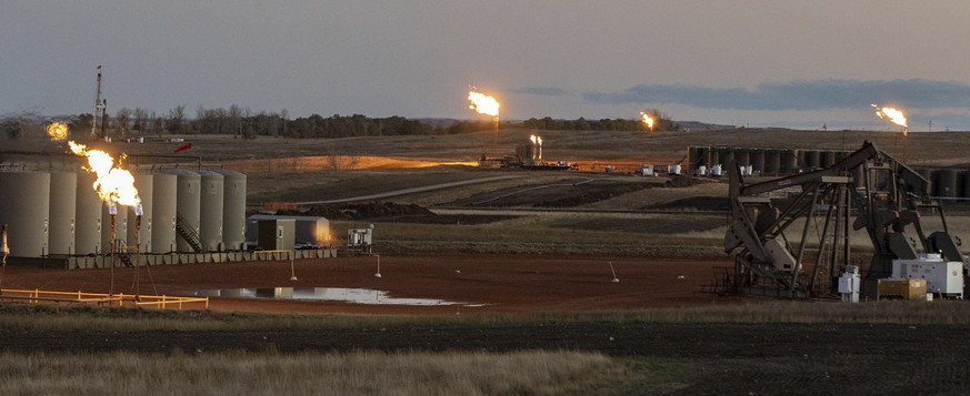 A multi-well oil pad burns natural gas on the Fort Berthold Indian Reservation in North Dakota on Oct. 27, 2021. Over much of the last decade, oil and gas operators in Texas and a dozen other U.S. sta ...