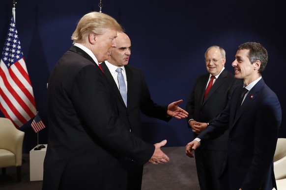 Swiss Federal Councillor Ignazio Cassis, right, welcomes US President Donald J. Trump, left, next to Swiss Federal President Alain Berset and Swiss Federal Councillor Johann Schneider-Ammann, during a ...