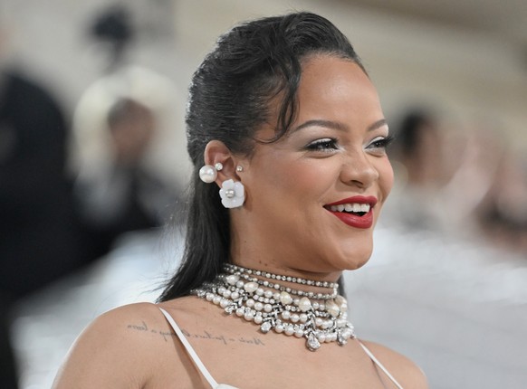 FILE - Rihanna shows off her baby bump at The Metropolitan Museum of Art&#039;s Costume Institute benefit gala celebrating the opening of the &quot;Karl Lagerfeld: A Line of Beauty&quot; exhibition on ...