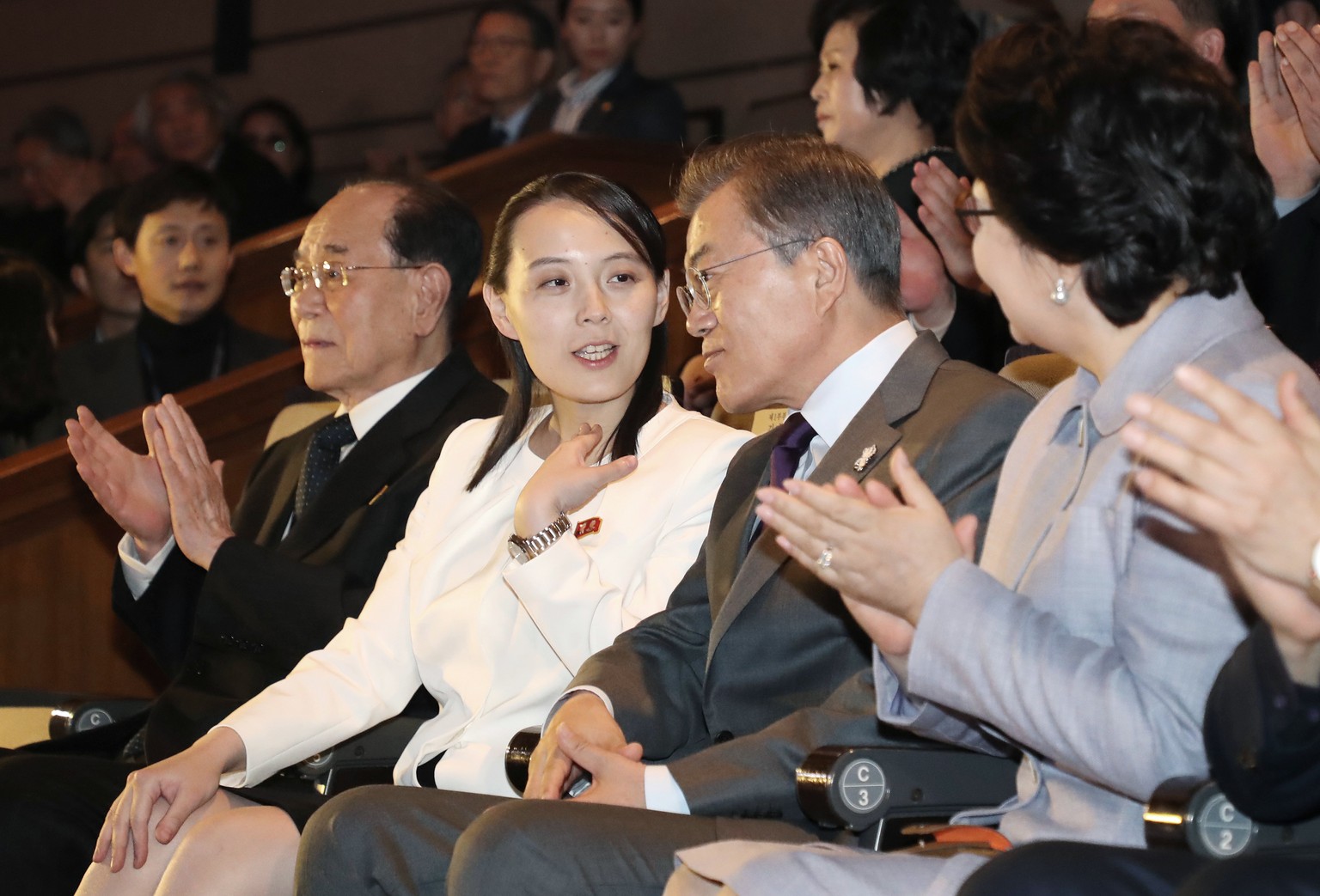 South Koran President Moon Jae-in, third from left, talks with Kim Yo Jong, second from left, North Korean leader Kim Jong Un&#039;s sister, as they watch a performance of North Korea&#039;s Samjiyon  ...