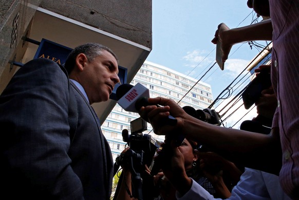 epa07379010 The Superior Prosecutor Rafael Vela (L), Coordinator of the Lava Jato special team, addresses the media after taking part in the hearing of former Odebrecht construction officers and the s ...