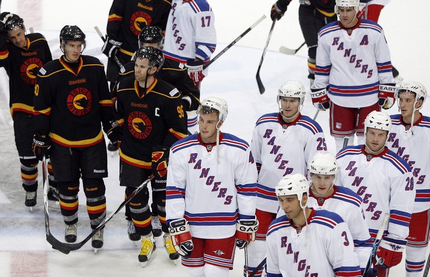 Bern players, left, and New York Rangers leave the stadium after an Ice Hockey exhibition game between SC Bern and New York Rangers, at the Postfinance Arena in Bern, Switzerland, Tuesday, September 3 ...