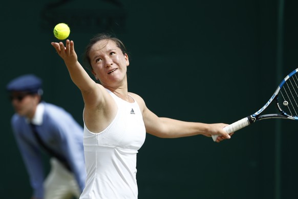 Lulu Sun of Switzerland in action during her first round girls&#039; singles match against Kayla Day of USA at the Wimbledon Championships at the All England Lawn Tennis Club, in London, Britain, 10 J ...