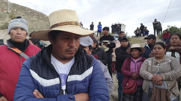 Relatives of trapped miners wait outside the SERMIGOLD mine in Arequipa, Peru, Sunday, May 7, 2023. The Public Ministry confirmed the death of 27 miners, who were trapped early Saturday morning due to ...