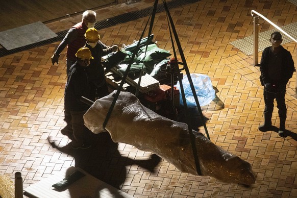 The &quot;Pillar of Shame&quot; statue, a memorial for those killed in the 1989 Tiananmen crackdown, is removed from the University of Hong Kong, Thursday, Dec. 23, 2021. The monument at the universit ...