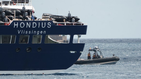 epa12947797 The MV Hondius cruise ship, affected by several hantavirus cases, remains anchored inside the Port of Granadilla de Abona in Tenerife, Spain, 11 May 2026. Authorities prepared to disembark ...