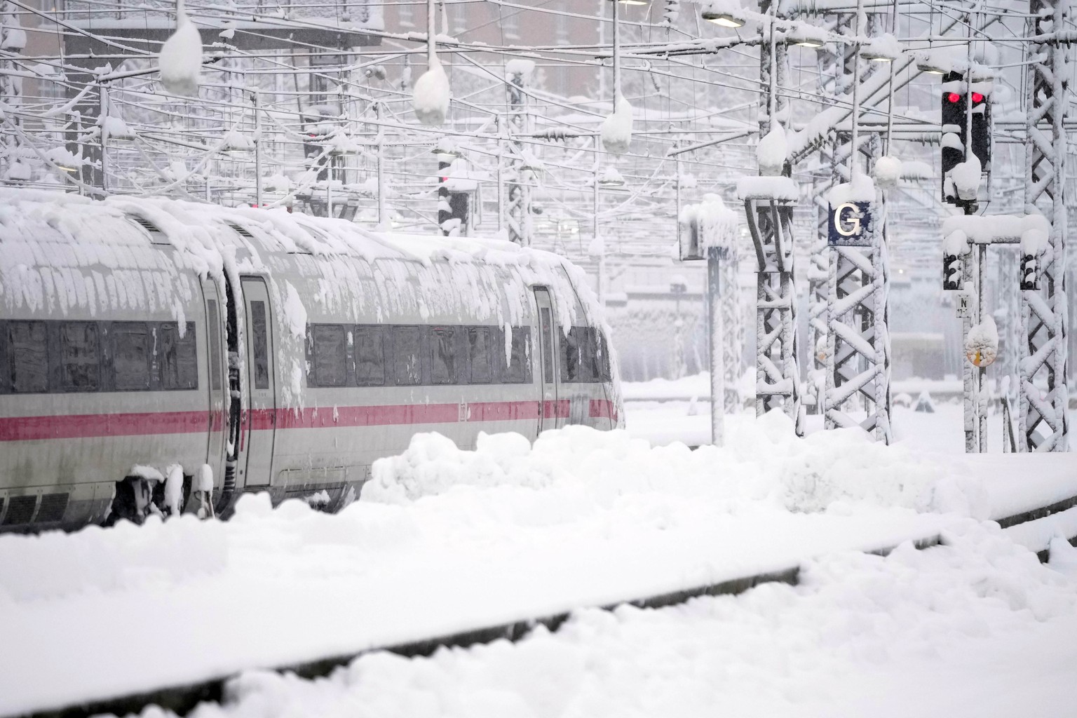 A train is parked at the central station after heavy snow fall in Munich, Germany, Saturday, Dec. 2, 2023. (AP Photo/Matthias Schrader)