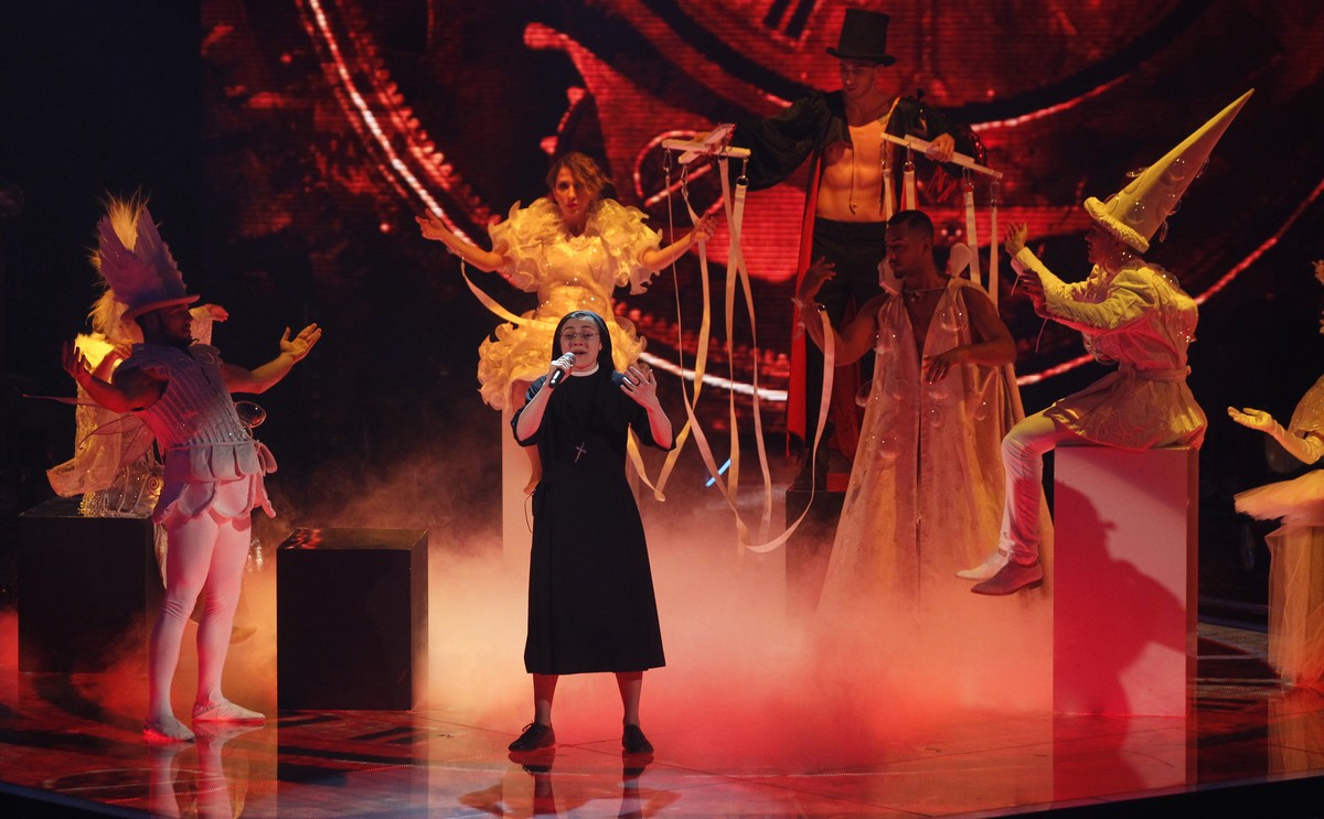 Sister Cristina Scuccia performs during the final of the Italian version of the TV talent show "The Voice" in Milan, Italy, Thursday, June 5, 2014. With her full habit, sensible shoes and ch ...
