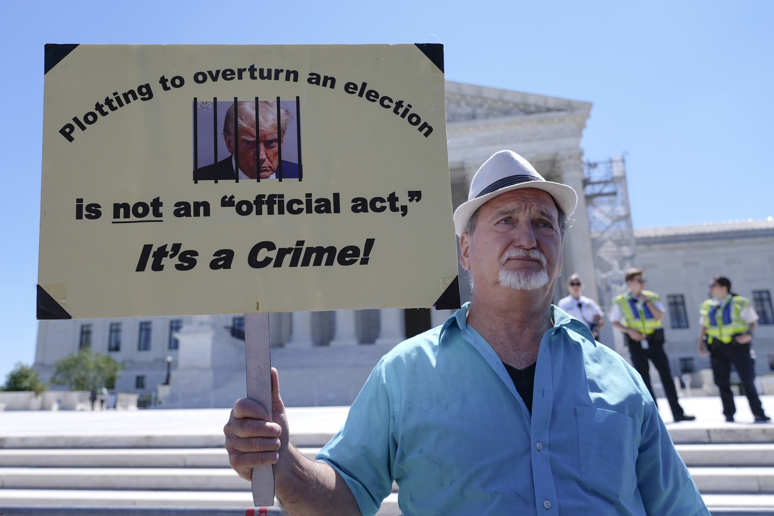 People protest outside the Supreme Court Monday, July 1, 2024, in Washington. (AP Photo/Mariam Zuhaib)