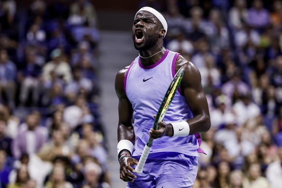 epa11590592 Frances Tiafoe of the United States reacts against Taylor Fritz of the United States during their semifinal match at the US Open Tennis Championships at the USTA Billie Jean King National  ...