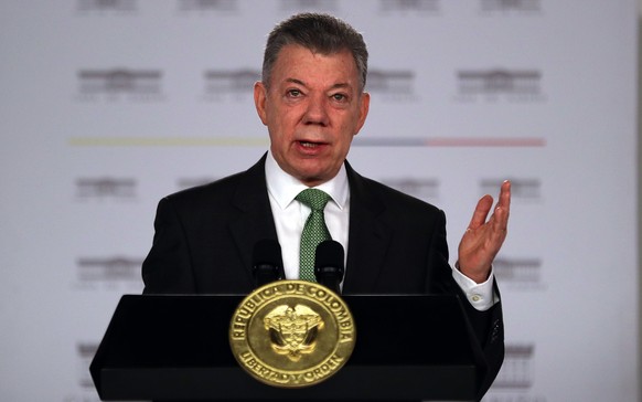 epa06924075 Colombian President Juan Manuel Santos speaks, in Bogota, Colombia, 02 August 2018. Santos reiterated the criticisms of the Venezuelan government of Nicolas Maduro and insisted that a huma ...