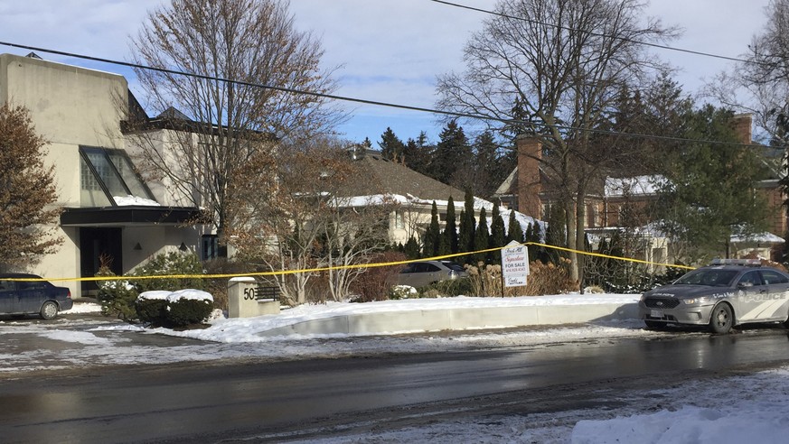 Police tape surrounds the home of billionaire Barry Sherman on Saturday, Dec. 17 2017, in Toronto. Sherman and his wife were found dead in the north Toronto mansion on Friday, Dec. 16. Police are inve ...