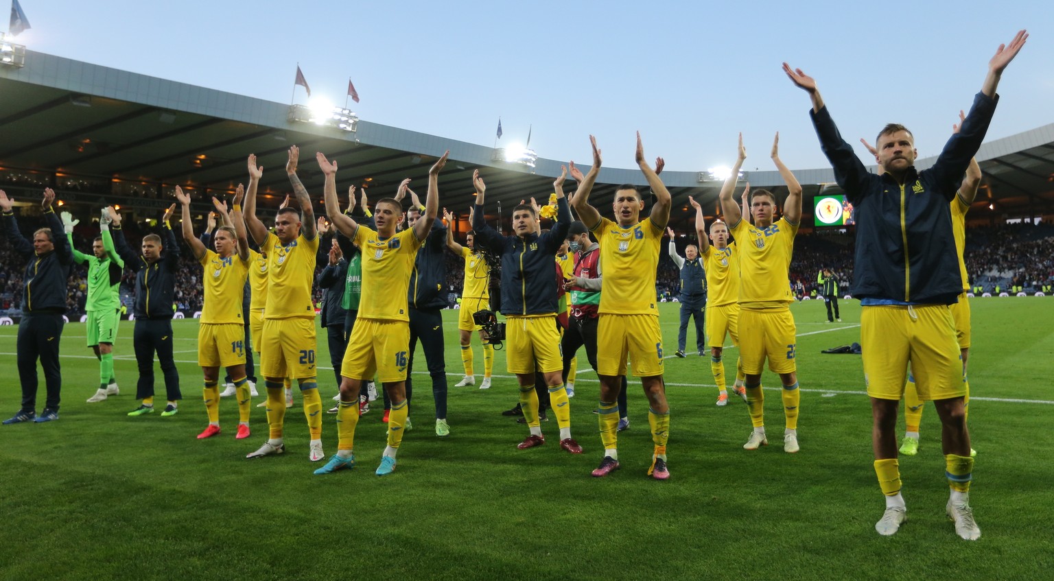 epa09990709 Ukraine players celebrate after the FIFA World Cup 2022 qualification playoff semi final soccer match between Scotland and Ukraine at Hampden Park in Glasgow, Scotland, Britain, 01 June 20 ...