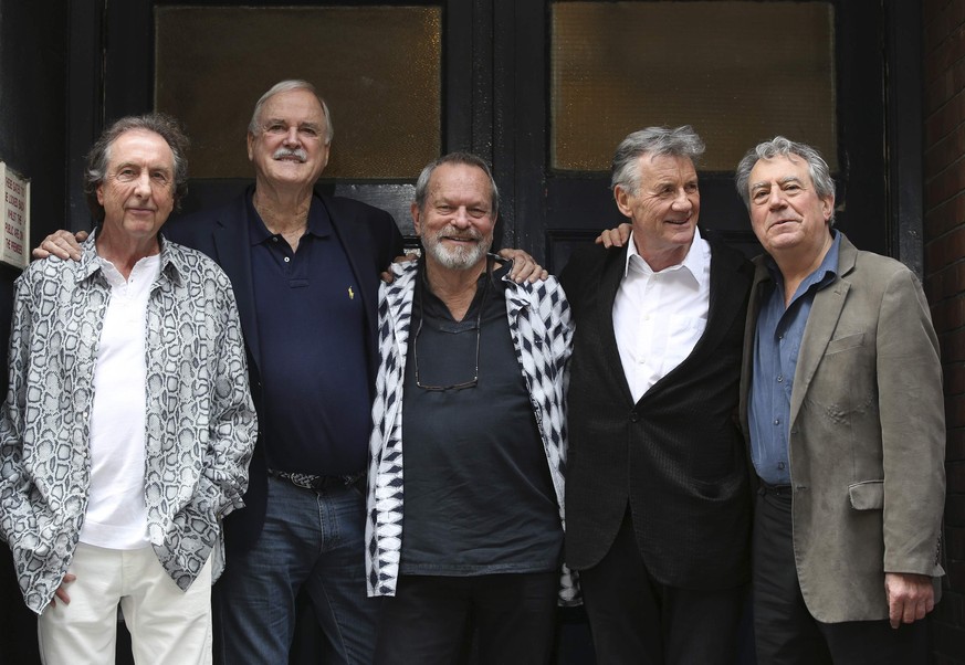 Members of British comedy troupe Monty Python (L-R) Eric Idle, John Cleese, Terry Gilliam, Michael Palin and Terry Jones pose for a photograph during a media event in central London, June 30, 2014. Th ...