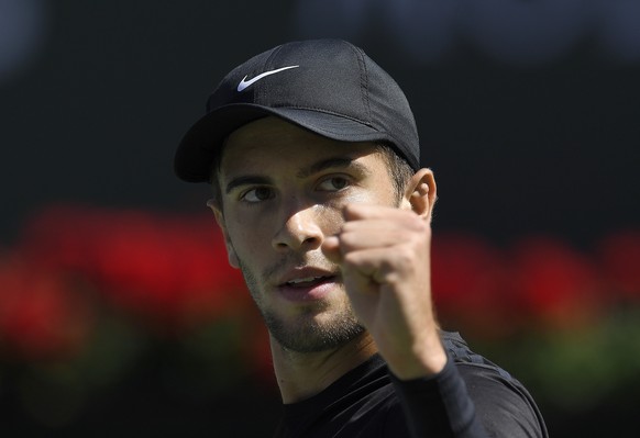 Borna Coric, of Croatia, celebrates after winning a game against Kevin Anderson, of South Africa, during the quarterfinals at the BNP Paribas Open tennis tournament, Thursday, March 15, 2018, in India ...