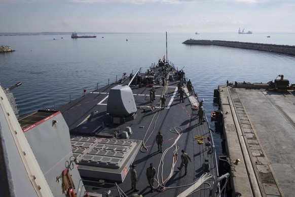 epa06661321 A handout photo made available by the US Navy on 10 April 2018 shows the Arleigh Burke-class guided-missile destroyer USS Donald Cook (DDG 75) departing Larnaca, on the southern coast of C ...