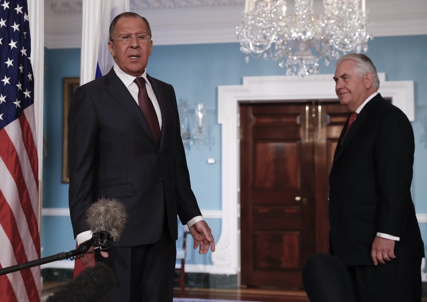 Secretary of State Rex Tillerson, right, looks to Russian Foreign Minister Sergey Lavrov as he speak to media at the State Department in Washington, Wednesday, May 10, 2017. (AP Photo/Carolyn Kaster)