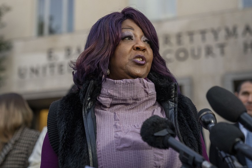 Ruby Freeman speaks with reporters outside federal court, Friday, Dec. 15, 2023, in Washington. A jury awarded $148 million in damages on Friday to two former Georgia election workers, Freeman and her ...