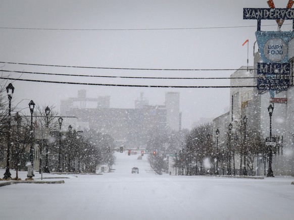 Snow continues to fall in Near Southside Thursday, Feb. 3, 2022, in Fort Worth, Texas. More than 200,000 homes and businesses lost power across the U.S. on Thursday as freezing rain and snow weighed d ...