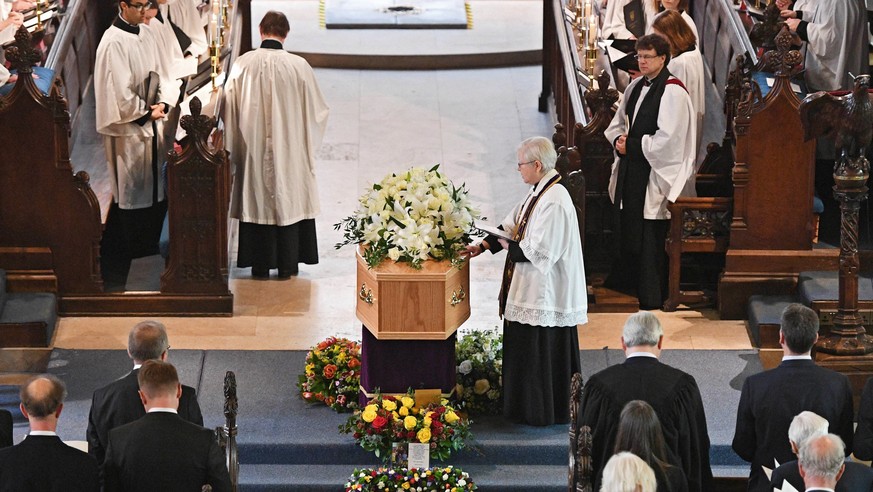 epa06639140 People attend during the funeral of Stephen Hawking at the University Church of St. Mary the Great in Cambridge, Britain, 31 March 2018. World-renowned British physicist Stephen Hawking di ...