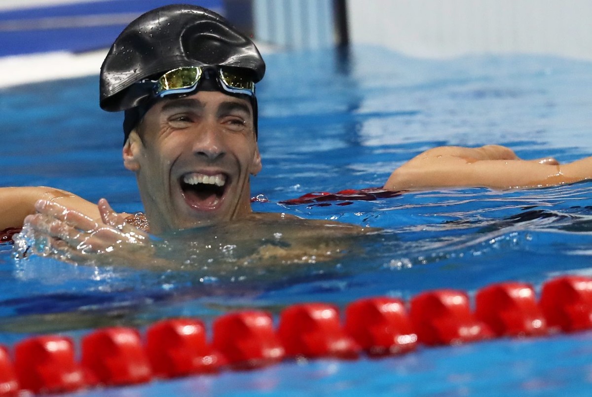 epa05479154 Michael Phelps of USA reacts to his fellow second placed after the men's 100m Butterfly Final race of the Rio 2016 Olympic Games Swimming events at Olympic Aquatics Stadium at the Oly ...