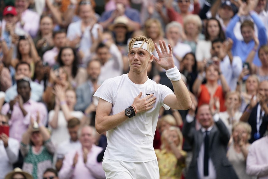 Canada&#039;s Denis Shapovalov acknowledges the crowd after being defeated by Serbia&#039;s Novak Djokovic during the men&#039;s singles semifinals match on day eleven of the Wimbledon Tennis Champion ...