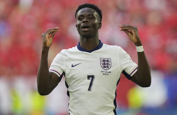 England&#039;s Bukayo Saka celebrates scoring his side&#039;s first goal during a quarterfinal match between England and Switzerland at the Euro 2024 soccer tournament in Duesseldorf, Germany, Saturda ...