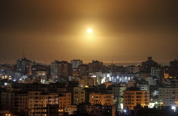 epa09464761 Streaks of light are seen as Israel?s Iron Dome anti-missile system intercepts a rocket launched from the Gaza Strip towards Israel, as seen from the southern Gaza Strip, 13 September 2021 ...