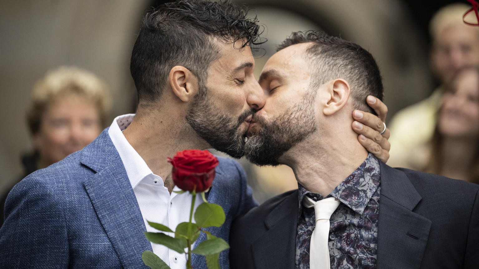 epa10045182 Luca Morreale (L) and Stefano Perfetti kiss each other after having their registered partnership officially changed into a marriage at the registry office in Zurich, Switzerland, 01 July 2 ...