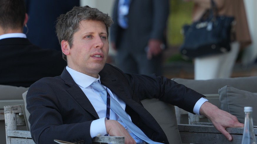 FILE - CEO of OpenAI Sam Altman talks to CEO of Google DeepMind Demis Hassabis, not seen, on the sidelines of the G7 summit, Wednesday, June 17, 2026, in Evian-les-Bains, France. (AP Photo/Julia Demar ...