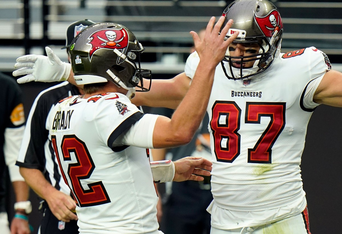FILE - In this Oct. 25, 2020, file photo, Tampa Bay Buccaneers tight end Rob Gronkowski (87) celebrates with quarterback Tom Brady (12), left, after scoring a touchdown against the Las Vegas Raiders d ...