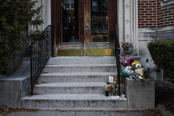Brookline, MA - December 18: Flowers and candles rest on the front steps of the home of Massachusetts Institute of Technology professor Nuno F.G. Loureiro on December 18, 2025. Police continue searchi ...