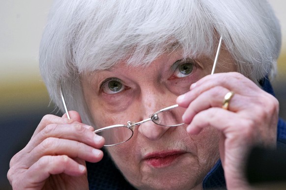 Federal Reserve Chair Janet Yellen removes her glasses as she testifies on Capitol Hill in Washington, Wednesday, July 12, 2017, before the House Financial Services Committee to give the semiannual mo ...