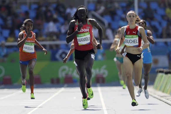 Kenya&#039;s Margaret Wambui, center, and Switzerland&#039;s Selina Buchel, right, during the athletics competitions of the 2016 Summer Olympics at the Olympic stadium in Rio de Janeiro, Brazil, Wedne ...