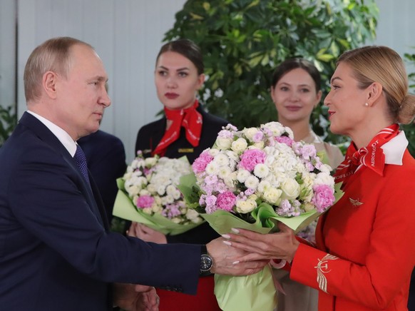 Russian President Vladimir Putin congratulates representatives of the flight crew of Russian Airlines for the upcoming International Women&#039;s Day as he visits to Aeroflot Aviation School outside M ...