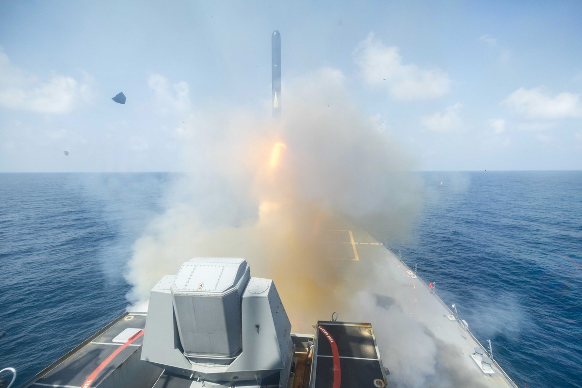 epa12787579 A handout photo made available by the US Central Command (CENTCOM) Public Affairs shows the Arleigh Burke-class guided-missile destroyer USS Spruance (DDG 111) launching a Tomahawk Land At ...