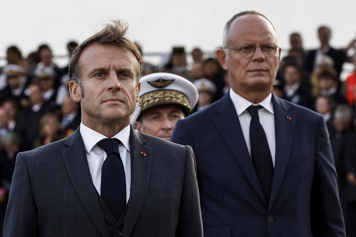 French President Emmanuel Macron, left, and Edouard Philippe, Mayor of Le Havre and Horizons parliamentary group leader attend a ceremony commemorating the 80th anniversary of the liberation of the po ...
