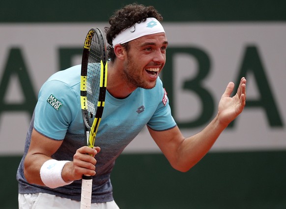 epa06787310 Marco Cecchinato of Italy reacts as he plays Novak Djokovic of Serbia during their men’s quarter final match during the French Open tennis tournament at Roland Garros in Paris, France, 05  ...