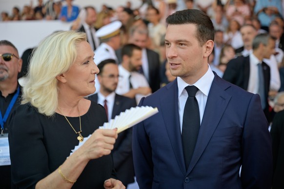 Far-right leader Marine Le Pen and Far-right party National Rally president Jordan Bardella arrive to attend the 10th anniversary of the deadly 2016 truck attack in Nice, southern France, Tuesday, Jul ...