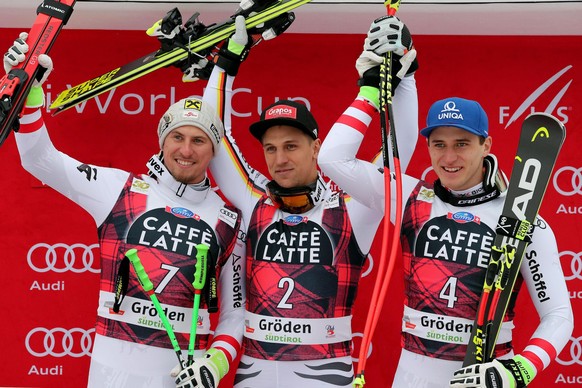 epa06391666 Winner Josef Ferstl (C) of Germany with second placed Max Franz (L) of Austria and third placed Matthias Mayer (R) of Austria celebrate on the podium for the Men&#039;s Super-G race at the ...