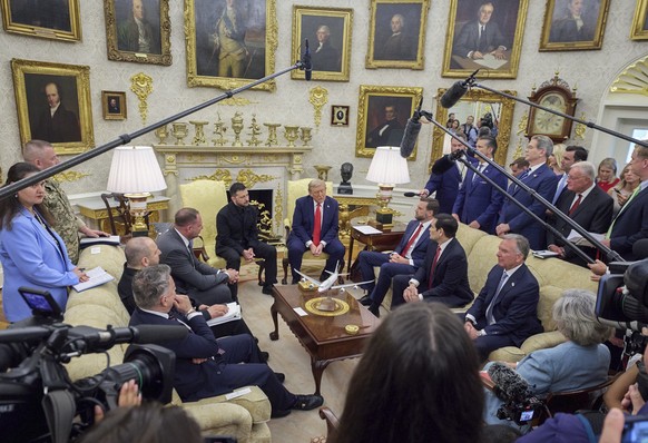 epa12308713 A handout photo made available by the Presidential Press Service shows United States President Donald J Trump (R) meets President of Ukraine Volodymyr Zelensky (L) in the Oval Office of th ...