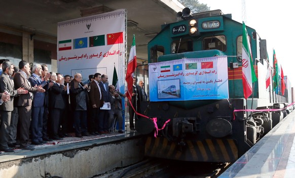 epa05161915 The first Chinese cargo train, to be used following Iran-China joint efforts to revive the Silk Road, arrives in Tehran, Iran, 15 February 2016. Reports said the 32-containers train, each  ...