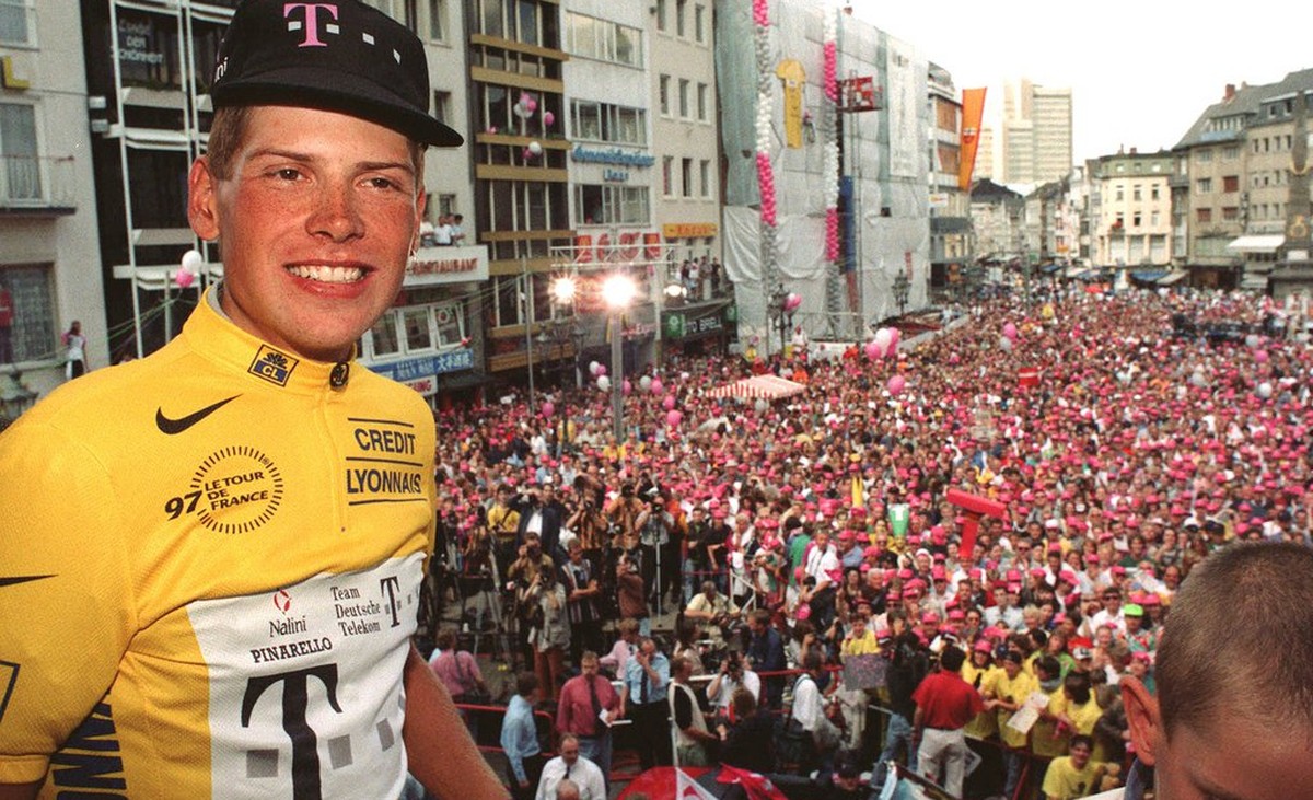 Germany's Tour de France winner Jan Ullrich presents his yellow shirt to the crowd of fans in Bonn, Germany, in this July 28, 1997 photo, during a reception for the German Telekom cycling team at ...