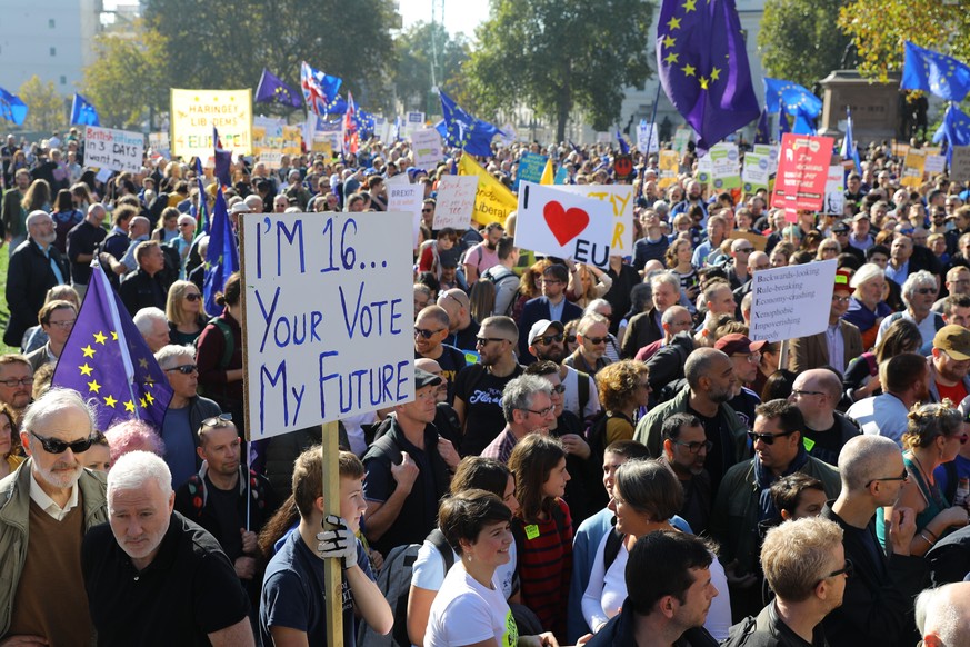 epa07106831 Demonstrators with banners during the People&#039;s Vote March for the Future in London, Britain, 20 October 2018. Reports state that the &#039;March for the Future&#039; is to be led by a ...