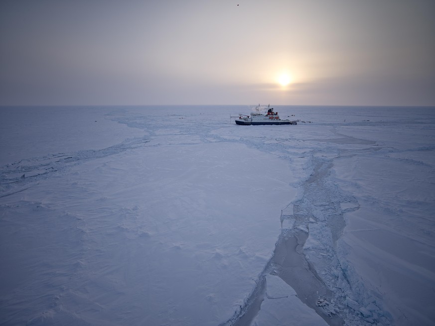 Aerial view of Polarstern in the arctic ice with a large lead system in the foreground